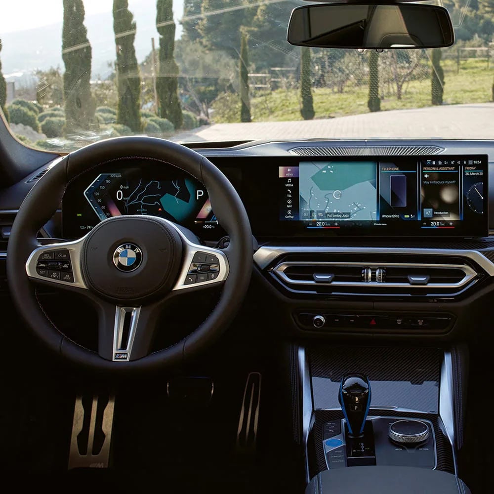 A driver's eye view of steering wheel and controls of the BMW i4 | BMW of Grand Blanc in Grand Blanc MI