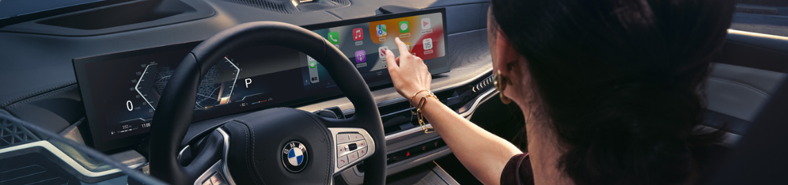 A customer playing with the BMW infotainment